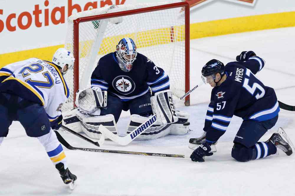 John Woods / The Canadian Press
Winnipeg Jets goaltender Michael Hutchinson (34) gets a toe on the shot from St. Louis Blues' Alex Pietrangelo (27) as Jets' Tyler Myers (57) defends during second period.