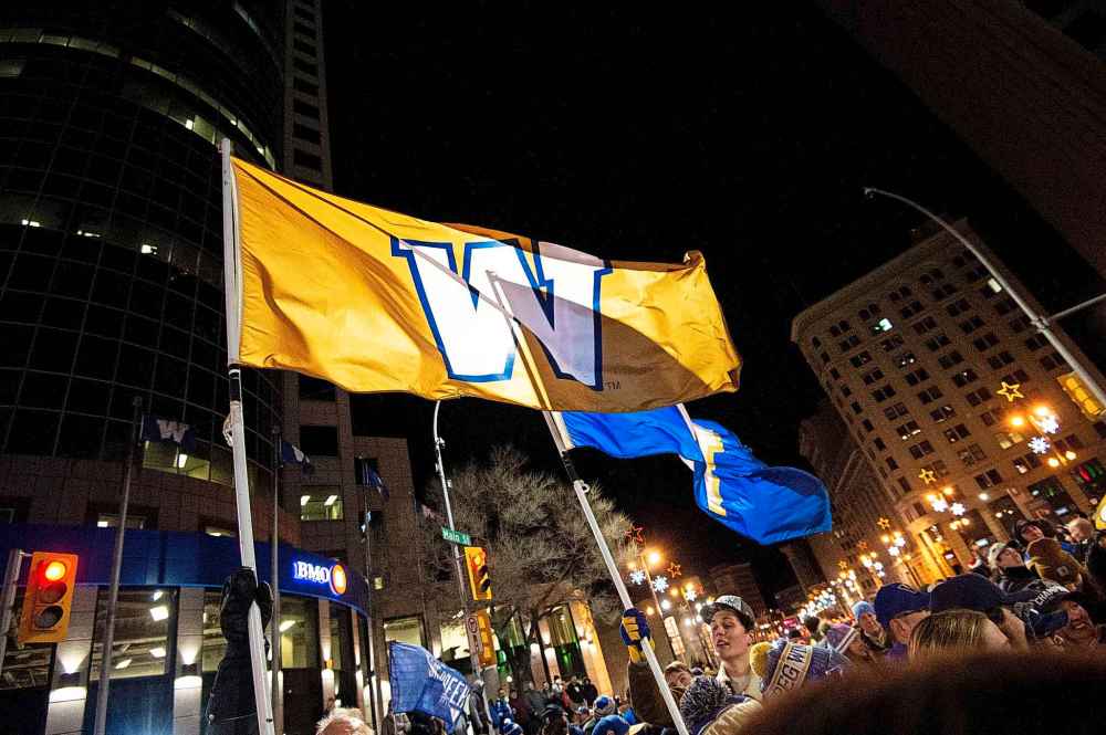 Blue and Gold Winnipeg Blue Bombers flags were flying high. (Mike Sudoma / Winnipeg Free Press)