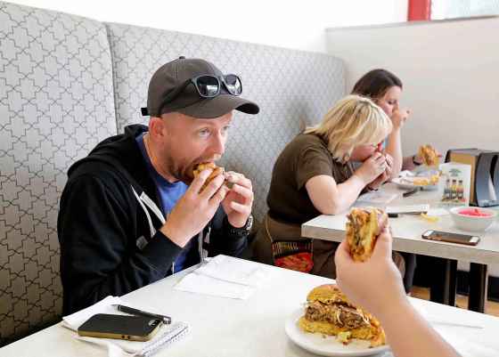 In this 2017 photo, Ben stuffs a Shawarma Khan’s Le Burger Week offering into his mouth, proving there’s no way for him to elegantly eat a burger. (Justin Samanski-Langille / Winnipeg Free Press files)