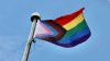 Altona, Man., is set to host its first Pride parade on Saturday. The progress Pride flag, pictured, adds a chevron to the traditional rainbow design that includes black and brown stripes to represent people of colour, while the light blue and pink stripes represent trans and non-binary people. (Jane Robertson/CBC)