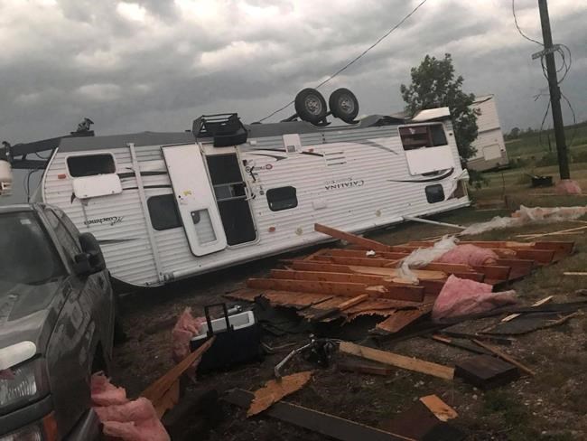 An overturned trailer is shown after a tornado at Margaret Bruce Beach, east of Alonsa, on Friday night. (Vanessa Whyte / The Canadian Press)