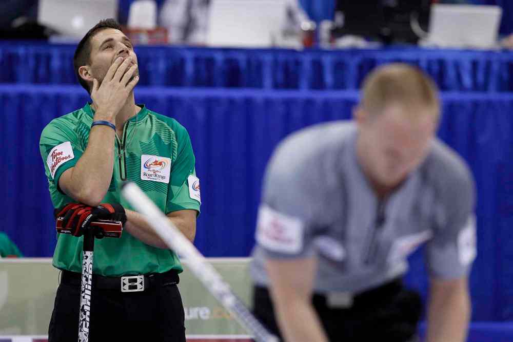 John Woods / The Canadian Press
John Morris (left) looks up during the men's final against Brad Jacobs (right) at the 2013 Roar of the Rings Canadian Olympic curling trials in Winnipeg Sunday.