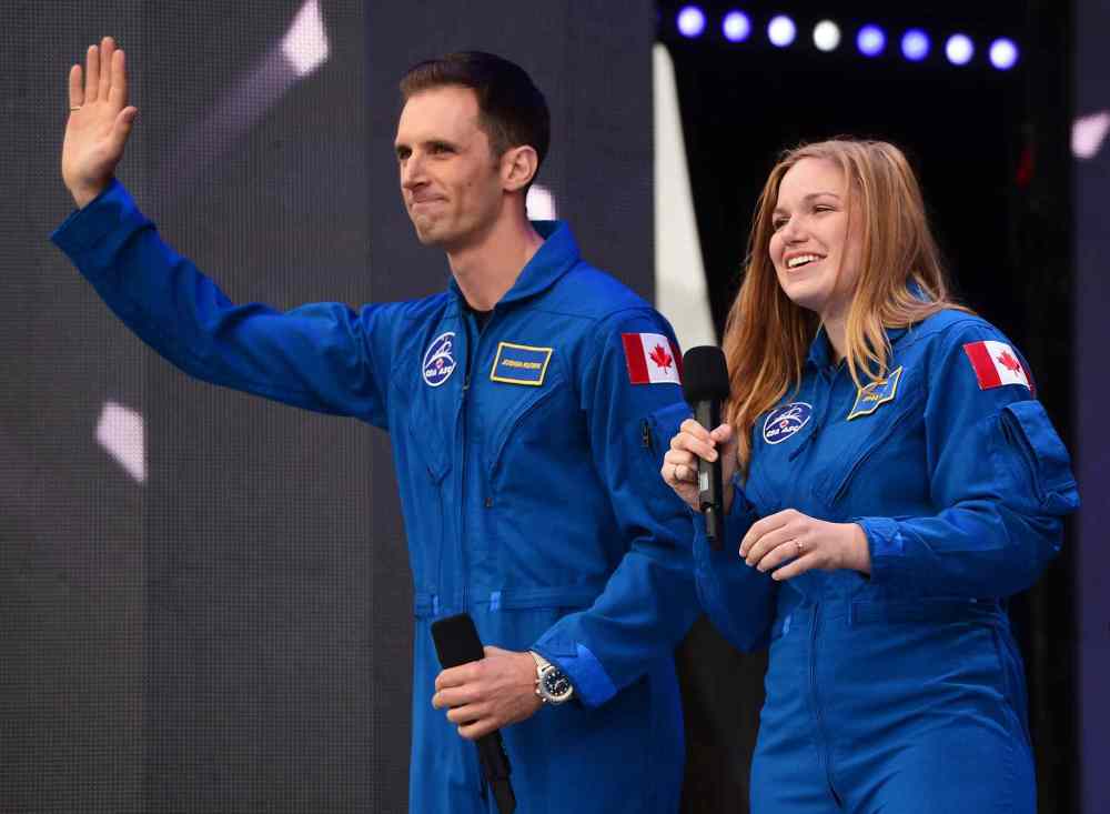 SEAN KILPATRICK / THE CANADIAN PRESS
Canada's newest astronauts Joshua Kutryk and Jennifer Sidey acknowledge the crowd during Canada 150 celebrations on Parliament Hill in Ottawa.