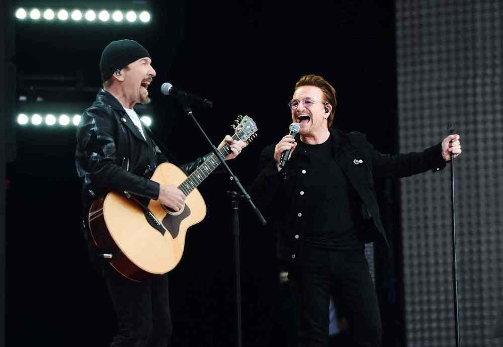 SEAN KILPATRICK / THE CANADIAN PRESS
U2's The Edge and Bono perform during Canada 150 celebrations on Parliament Hill in Ottawa.