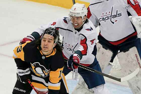 Brenden Dillon checks Brandon Tanev of the Penguins during a game in February. (Keith Srakocic / The Associated Press files)