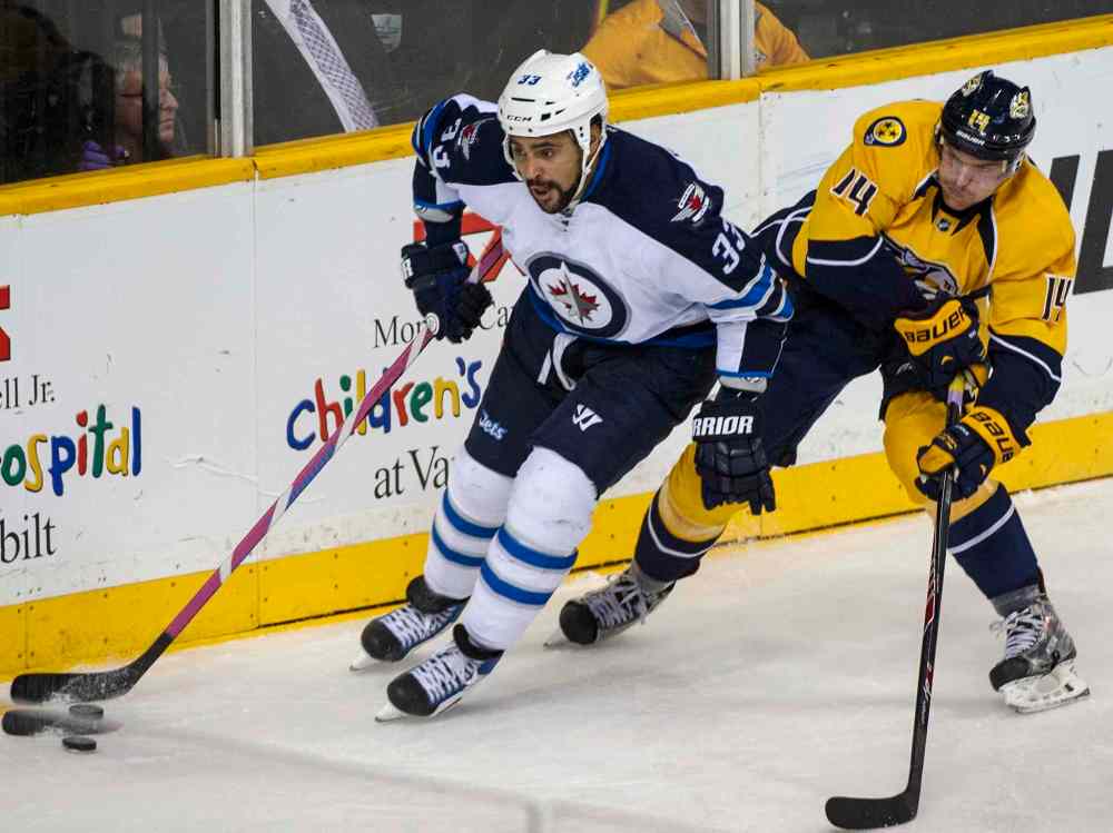 Nick Wagner photo
Winnipeg's Dustin Byfuglien controls the puck while Nashville's Mattias Ekholm applies pressure during the second period of Saturday's game.