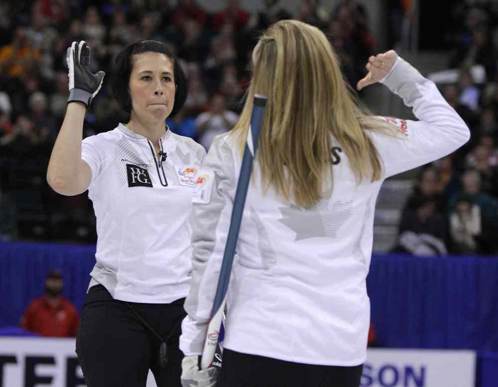 Jason Halstead / Winnipeg Free Press
Jennifer Jones high-fives Jill Officer (left) after a shot.