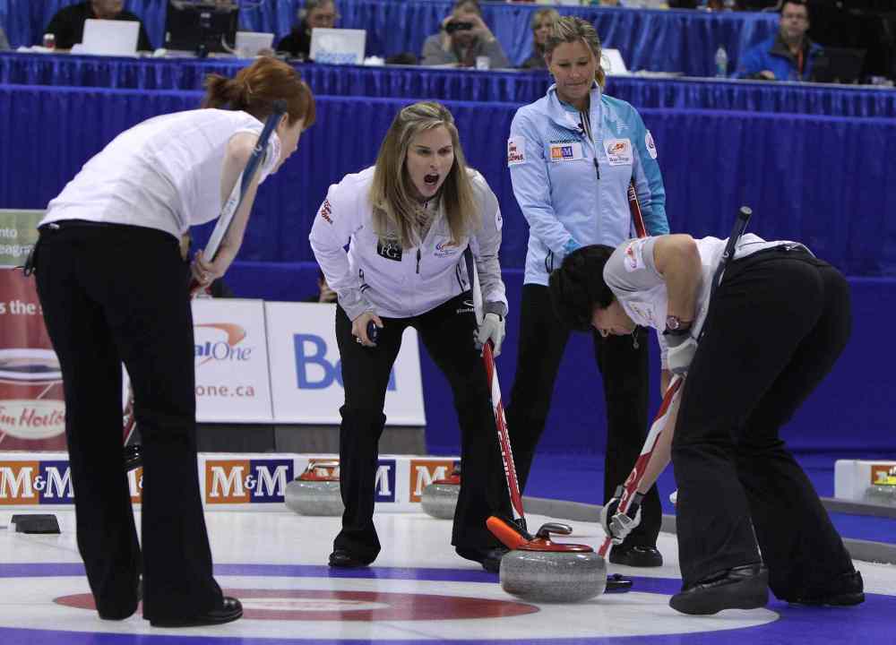 Jason Halstead / Winnipeg Free Press
Skip Jennifer Jones (centre left) calls on her sweeper Jill Officer (right) during action as Sherry Middaugh (right) looks on.