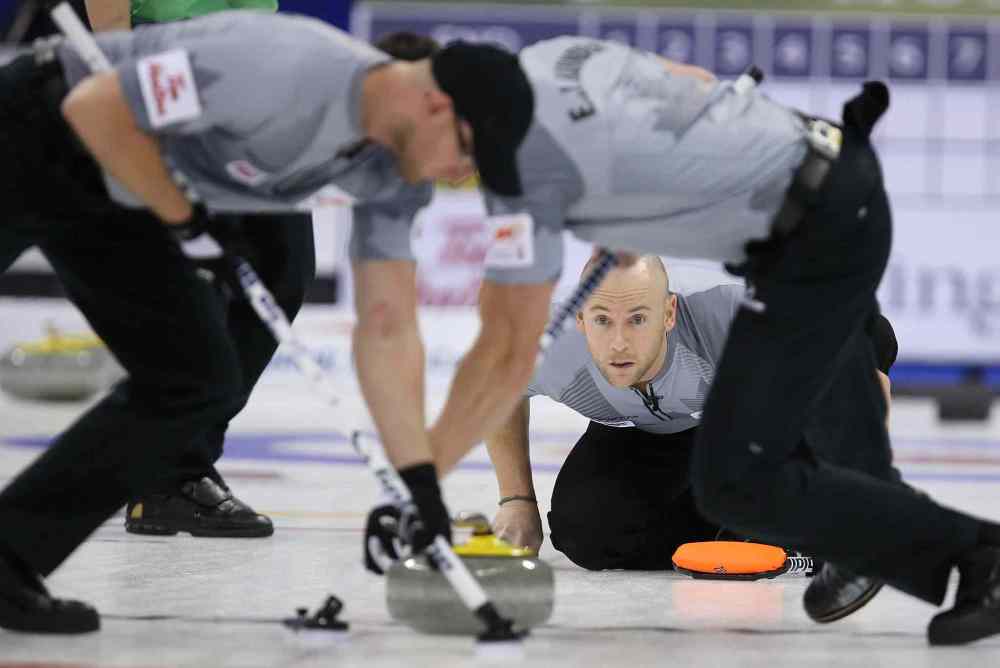 Jason Halstead / Winnipeg Free Press
Third Ryan Fry of Brad Jacobs' team watches his shot as the sweepers jump on the rock.