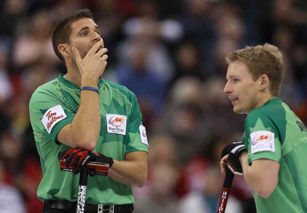 Jason Halstead / Winnipeg Free Press
Skip John Morris (left) reacts to a shot as Tyler Griffith looks on.