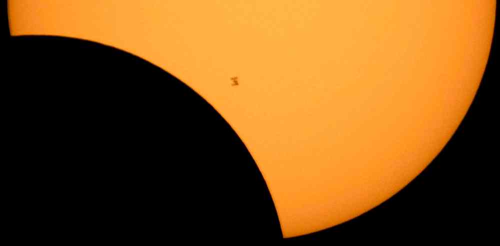 CP
The International Space Station is seen in silhouette as it transits the sun during a partial solar eclipse, Monday, Aug. 21, 2017, from Ross Lake, Northern Cascades National Park, in Washington. (Bill Ingalls/NASA via AP)