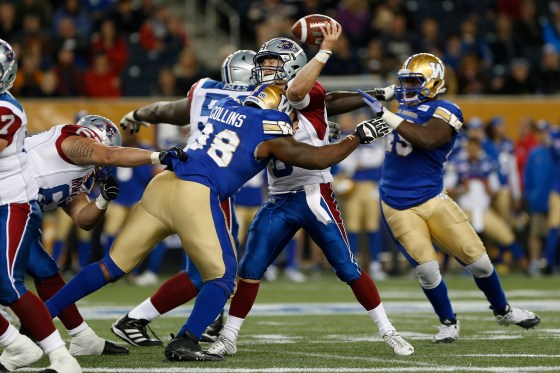John Woods / The Canadian Press Montreal Alouettes quarterback Jimmy Underdahl (8) gets the pass away despite pressure from Winnipeg Blue Bombers' Nate Collins (98) during the second half of pre-season CFL action in Winnipeg.