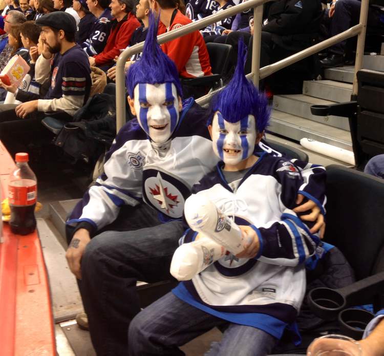 Boris Minkevich / Winnipeg Free Press
Jets fans show their true colours Saturday afternoon inside the MTS Centre as the Jets host the Ottawa Senators.
