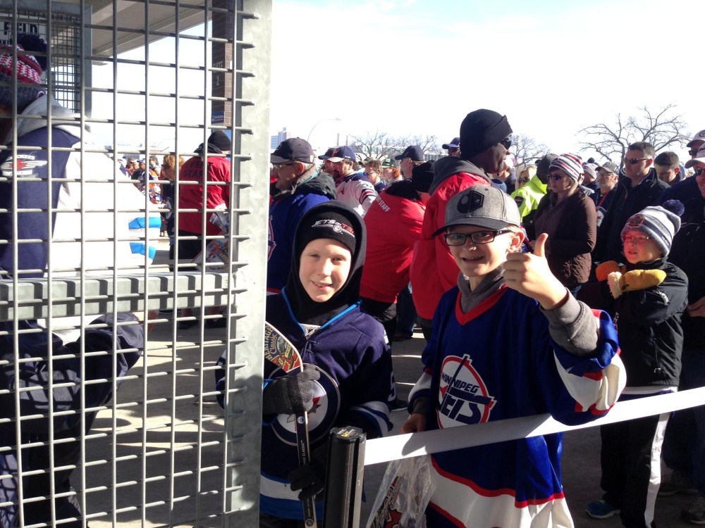 RUTH BONNEVILLE / WINNIPEG FREE PRESS
A couple of young fans are some of the first in line at Investors Group Field to take in the alumni game this afternoon between the Winnipeg Jets and Edmonton Oilers as part of the NHL's Heritage Classic weekend.