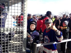 RUTH BONNEVILLE / WINNIPEG FREE PRESS
A couple of young fans are some of the first in line at Investors Group Field to take in the alumni game this afternoon between the Winnipeg Jets and Edmonton Oilers as part of the NHL