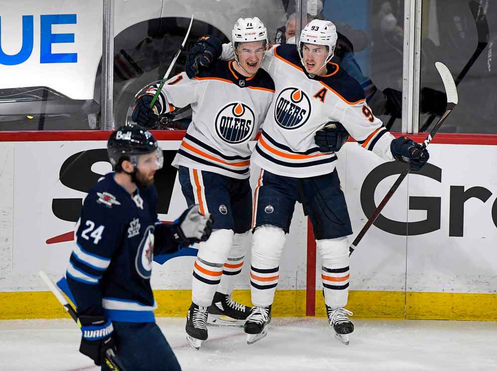 Ryan Nugent-Hopkins celebrates his goal with teammate Ryan McLeod during the second period.