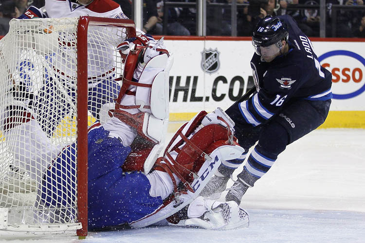 JOHN WOODS / The Canadian Press
Montreal Canadiens' goaltender Carey Price gets his glove on Winnipeg Jets' Andrew Ladd's rebound during the second period.