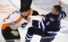 Trevor Hagan / The Canadian Press
Winnipeg Jets' Mark Stuart flails for a final punch during a fight with Philadelphia Flyers' Tye McGinn in the second period at MTS Centre Tuesday night.
