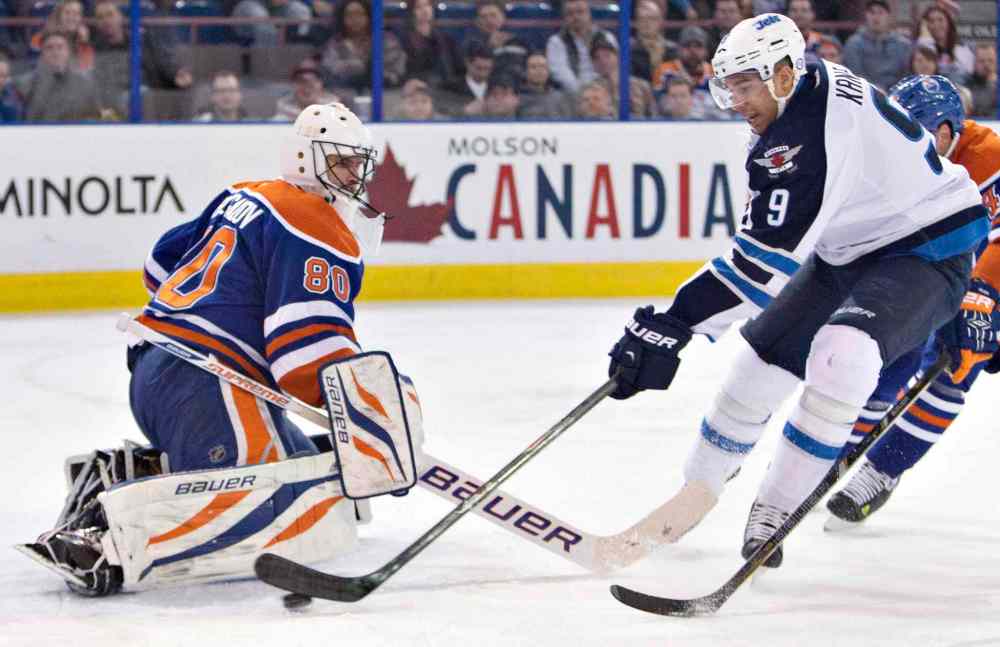 Jason Franson / The Canadian Press
Winnipeg Jets' Evander Kane (9) is stopped by Edmonton Oilers goalie Ilya Bryzgalov (80) during first period NHL hockey action in Edmonton, Alta., on Monday.