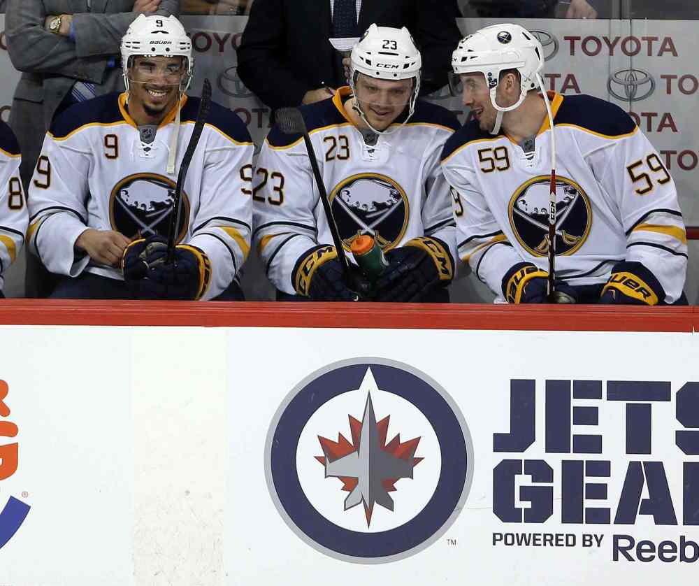 Trevor Hagan / The Canadian Press
Buffalo Sabres' Evander Kane (9), Sam Reinhart (23) and Tim Schaller (59) on the bench as time winds down during third period.