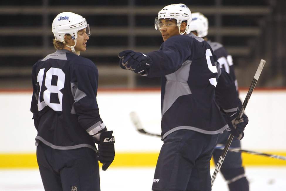 John Woods / The Canadian Press
Winnipeg Jets Evander Kane (9) talks with Bryan Little (18) on Sunday.