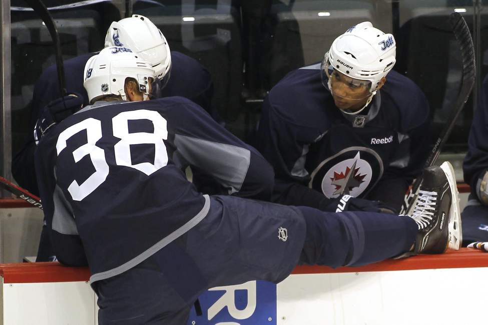 John Woods / The Canadian Press
Evander Kane (right) talks to Paul Postma (38) Sunday.