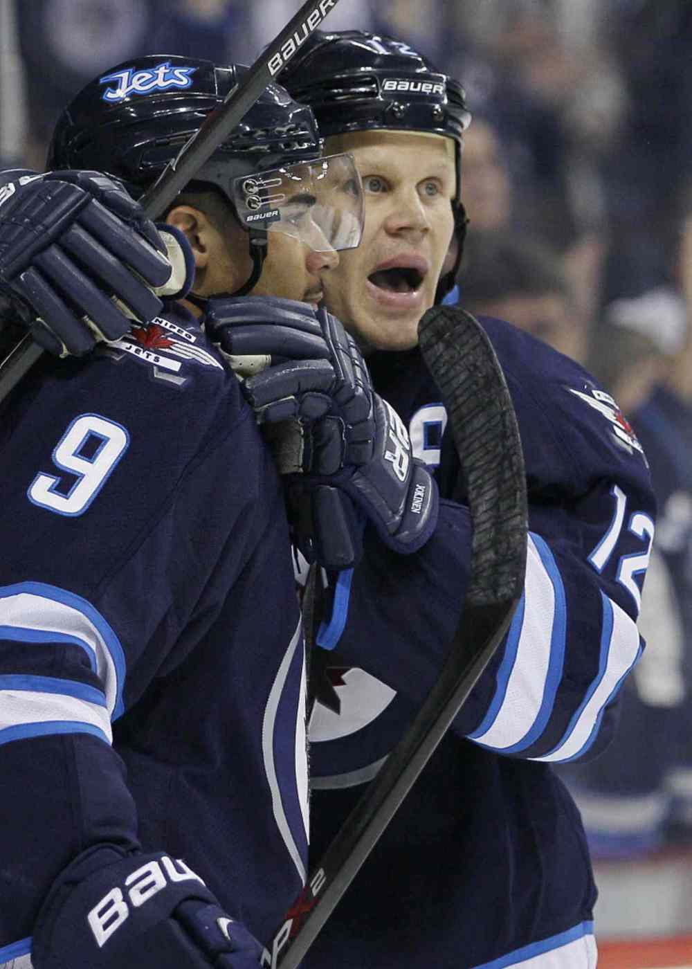 John Woods / The Canadian Press
Winnipeg Jets' Olli Jokinen (12) and Evander Kane (9) celebrate Jokinen's goal during the second period on Thursday.