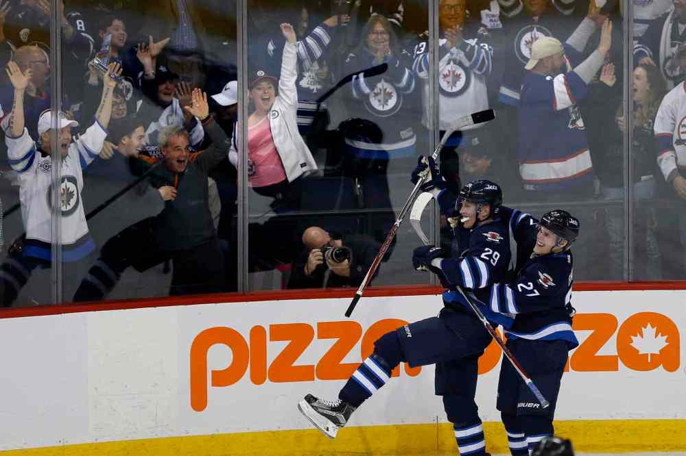 JOHN WOODS / THE CANADIAN PRESS
Winnipeg Jets' Nikolaj Ehlers (27) and Patrik Laine (29) celebrate Patrik Laine's (29) game winning goal and hat-trick during overtime against the Toronto Maple Leafs in NHL action in Winnipeg on Wednesday, October 19, 2016.