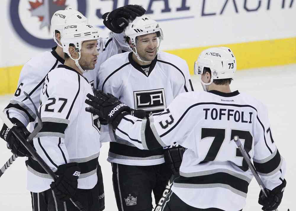 John Woods / The Canadian Press
Los Angeles Kings' Jake Muzzin (6), Alec Martinez (27), Justin Williams (14) and Tyler Toffoli (73) celebrate Martinez's goal against the Winnipeg Jets during third period NHL action.