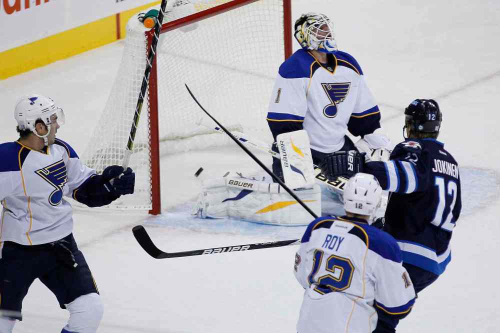 JOHN WOODS / THE CANADIAN PRESS
Winnipeg Jets' Olli Jokinen scores on St. Louis Blues goaltender Brian Elliott during the first period.