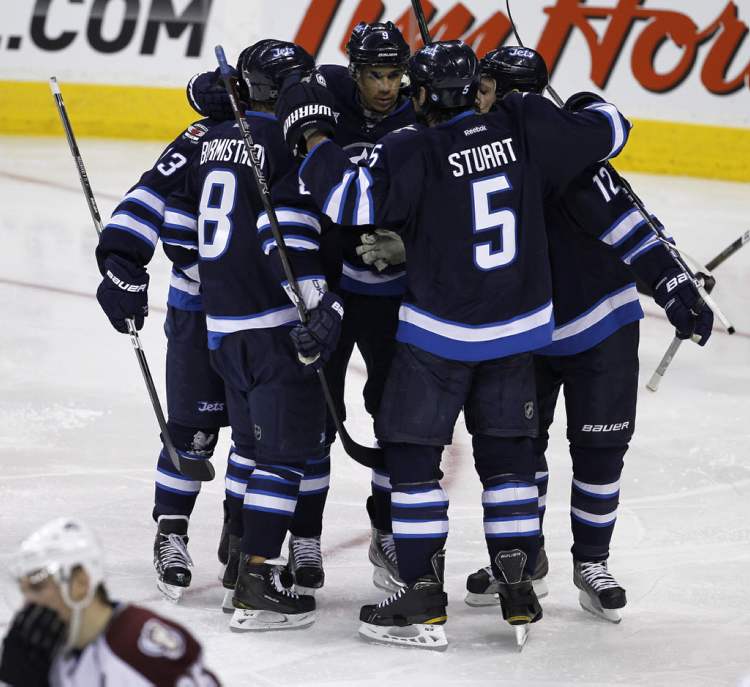 Trevor Hagan / The Canadian Press
The Winnipeg Jets' celebrate a goal by Evander Kane (9), middle, against the Colorado Avalanche during the second period.