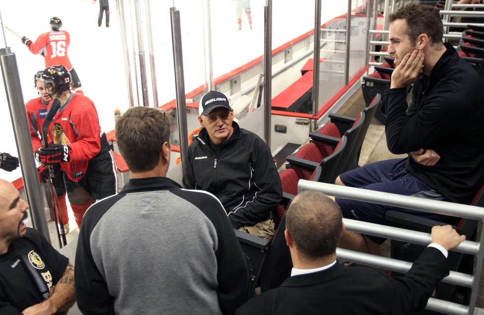 Jets Captain Andrew Ladd, right, visits the coaching staff of the Blackhawks. Ladd played for Chicago from 2007-2010. (JOE BRYKSA / WINNIPEG FREE PRESS)