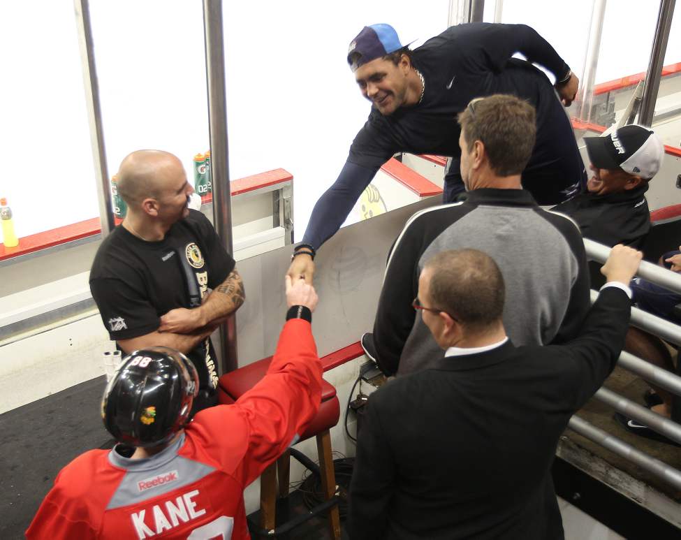 Winnipeg Jet Dustin Byfuglien shakes hands with Chicago's Patrick Kane. Byfuglien played for the Blackhawks from 2007-2010. (JOE BRYKSA / WINNIPEG FREE PRESS)