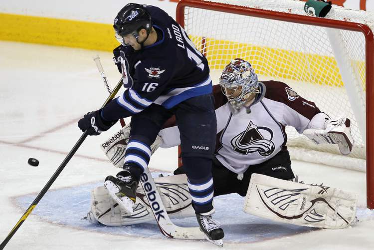 John Woods / The Winnipeg Free Press
Winnipeg Jets' Andrew Ladd (16), attempts the deflection against Colorado Avalanche's goaltender Semyon Varlamov (1)