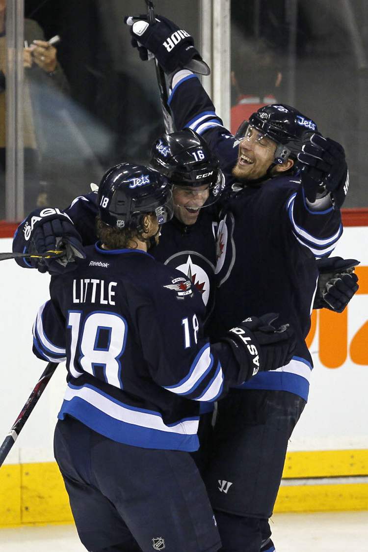 John Woods / The Winnipeg Free Press
Winnipeg Jets' Andrew Ladd (16), Bryan Little (18) and Blake Wheeler (26) celebrate Ladd's goal.