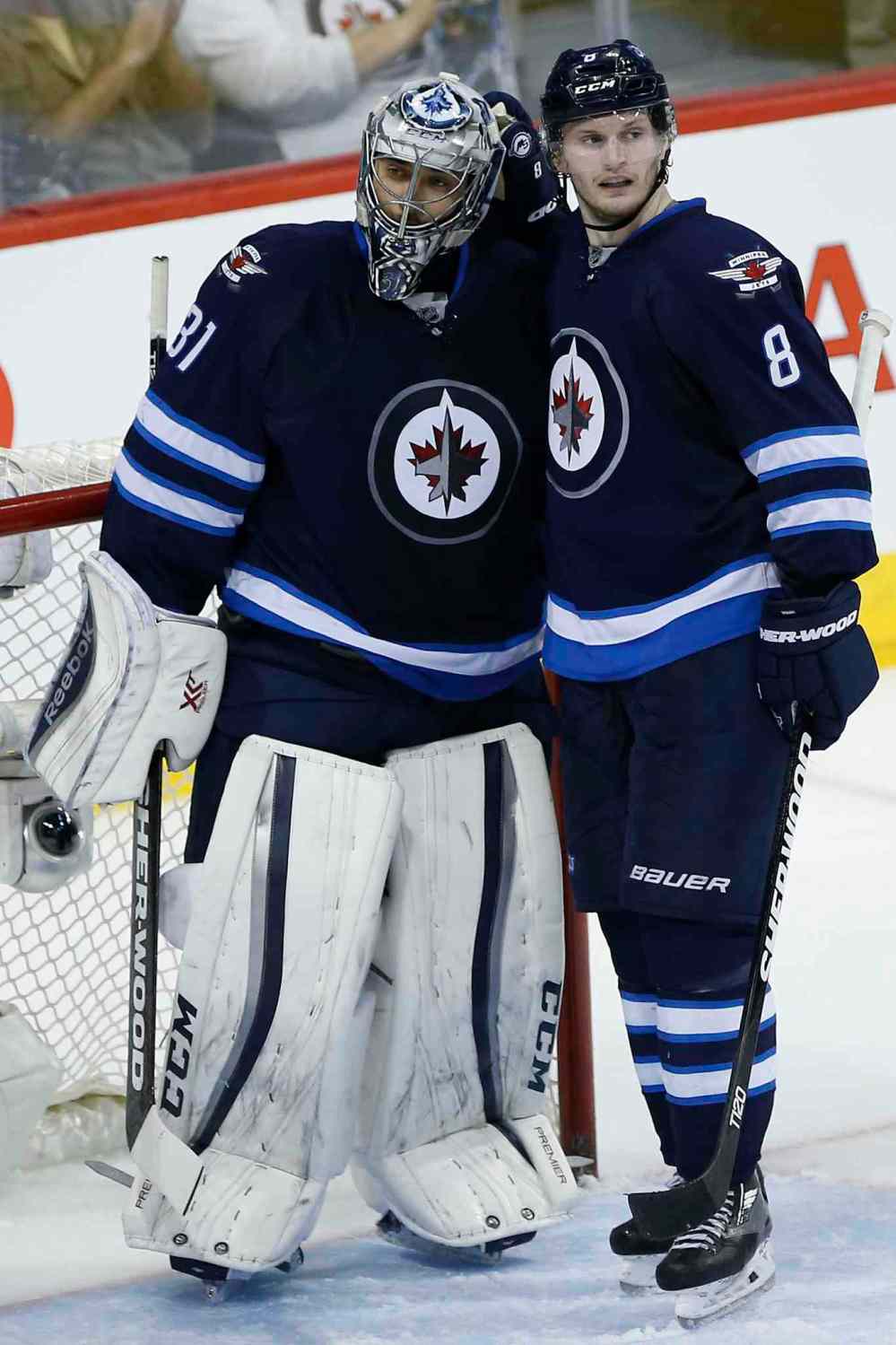 JOHN WOODS / WINNIPEG FREE PRESS
Winnipeg Jets' Jacob Trouba (8) celebrates a 5-1 win against the Minnesota Wild with goaltender Ondrej Pavelec (31) Sunday.