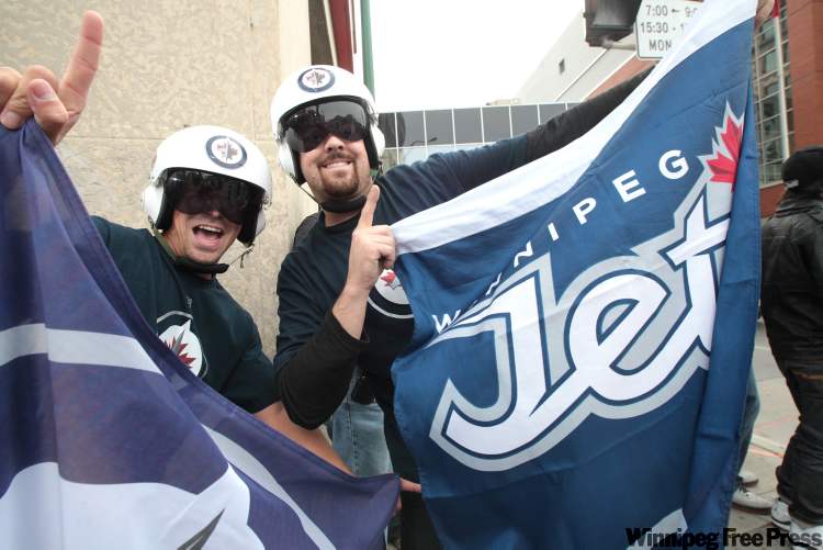 Cody Laschyn, left, and Norman Lavallee outside the MTS Centre (Mike Deal / Winnipeg Free Press)