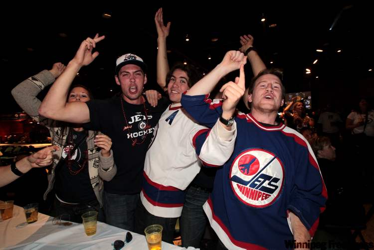 Fans watching the game at the Winnipeg Convention Centre cheer after the Jets score their first goal in the third period against the Montreal Canadiens. (Mike Deal / Winnipeg Free Press)