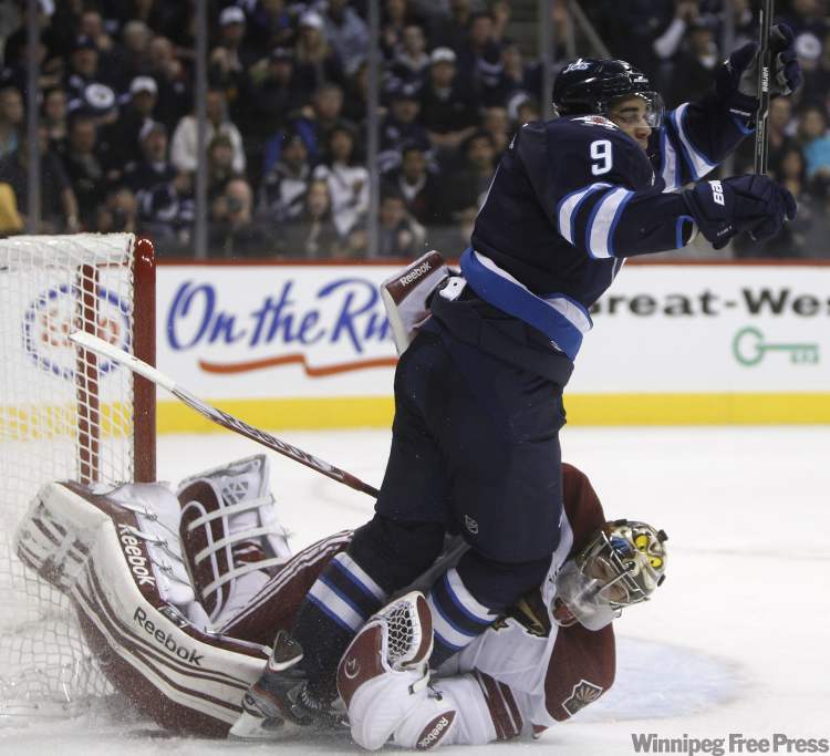 Trevor Hagan / Winnipeg Free Press
Winnipeg Jets' Evander Kane (9) crashes into Phoenix Coyotes' goaltender Mike Smith during the second period of play at the MTS Centre.