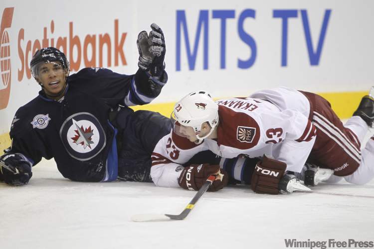 Trevor Hagan / Winnipeg Free Press
Winnipeg Jets' Evander Kane (9) looks for a penalty after being dragged down by Phoenix Coyotes' Oliver Ekman-Larsson (23) during the second period of play at the MTS Centre Thursday evening.