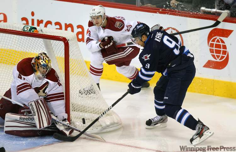 Phil Hossack / Winnipeg Free Press
Winnipeg Jet Evander Kane pokes at a loose puck in front of Pheonix netminder Mike Smith Thursday at the MTS Centre.