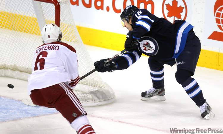 Phil Hossack / Winnipeg Free Press
Bryan Little opens up with an empty-netter against Pheonix Thursday at the MTS Centre.