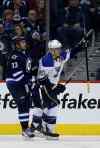 TREVOR HAGAN / THE CANADIAN PRESS
St. Louis Blues forward Alexander Steen (20) celebrates in front of Winnipeg Jets defenceman Dustin Byfuglien after scoring a goal during the second period of an NHL game against at the MTS Centre in Winnipeg Tuesday, Dec. 10, 2013.