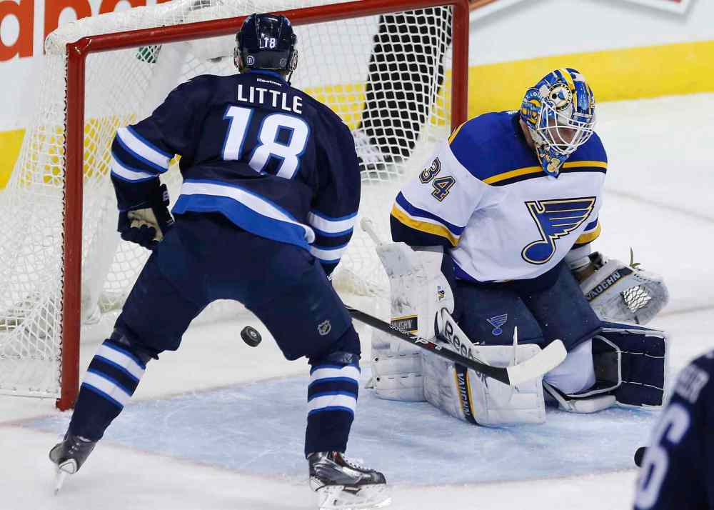 JOHN WOODS / THE CANADIAN PRESS
Winnipeg Jets centre Bryan Little scores on St. Louis Blues goalie Jake Allen during the first period.