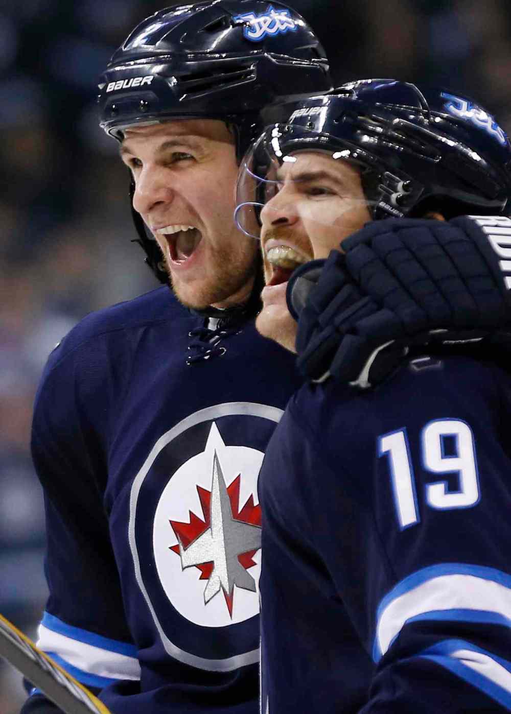 JOHN WOODS / THE CANADIAN PRESS
Winnipeg Jets Adam Pardy (left) and Jim Slater celebrate Slater's goal during the second period.