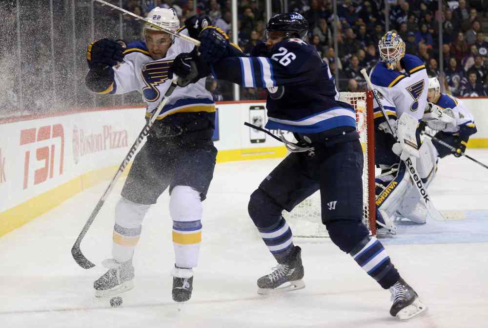 TREVOR HAGAN / WINNIPEG FREE PRESS
Jets winger Blake Wheeler checks Kevin Shattenkirk of the Blues during the second period.