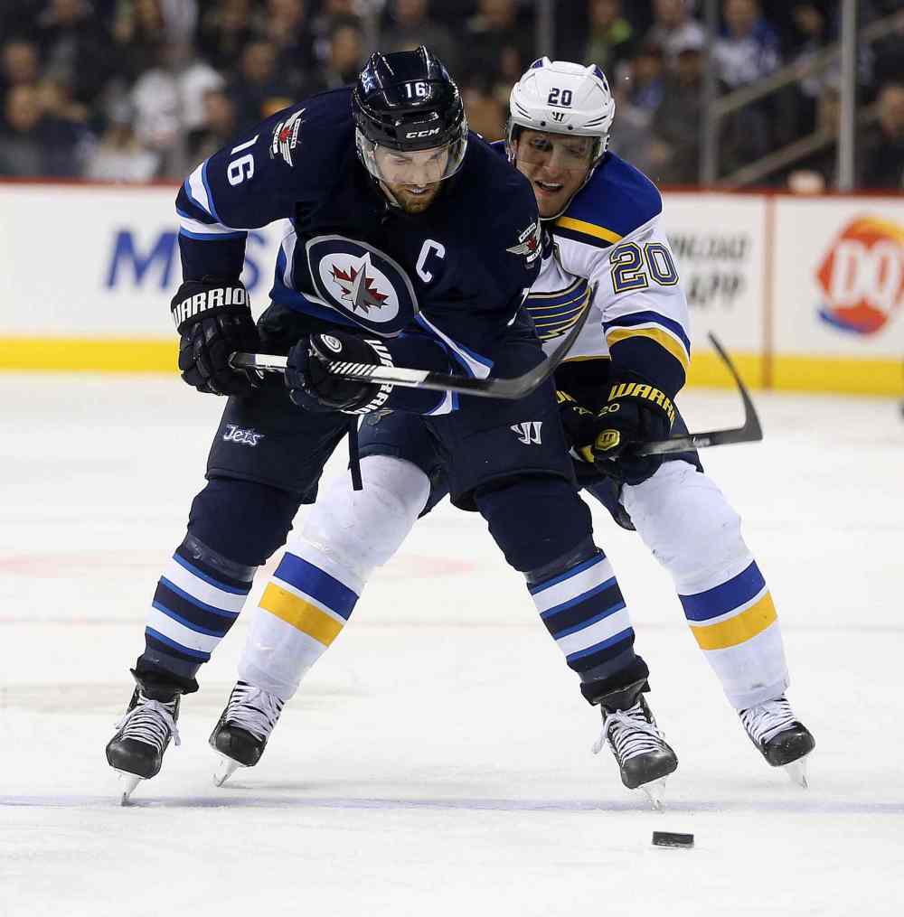 TREVOR HAGAN / WINNIPEG FREE PRESS
Winnipeg's Andrew Ladd battles with Winnipeg native Alexander Steen of the St. Louis Blues.