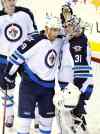 BILL KOSTROUN / THE ASSOCIATED PRESS
Winnipeg Jets goaltender Ondrej Pavelec celebrates with teammate Evander Kane after the Jets defeated the New Jersey Devils 3-1in Newark, N.J., Monday.