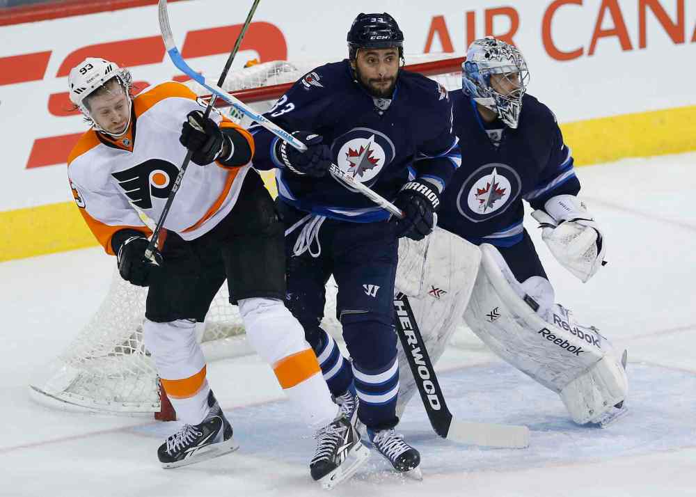 JOHN WOODS / WINNIPEG FREE PRESS
Jets defenceman Dustin Byfuglien clears Flyers forward Jakub Voracek from in front of goaltender Ondrej Pavelec during the first period.