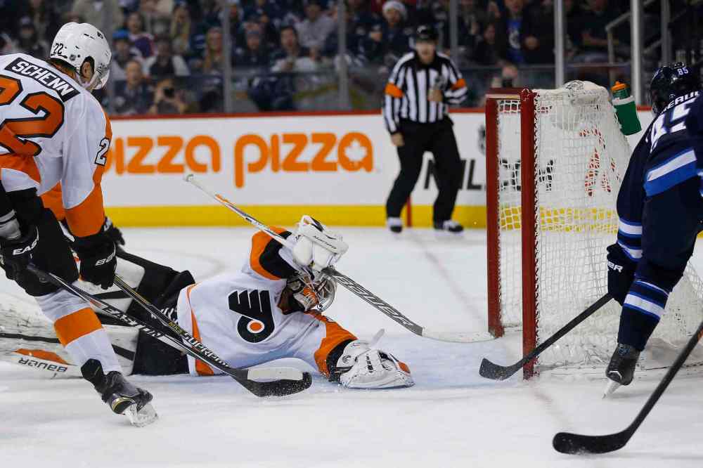 JOHN WOODS / WINNIPEG FREE PRESS
Flyers goalie Rob Zepp can't reach the puck before Jets forward Mathieu Perreault (85) slams it into the net during second period NHL action.